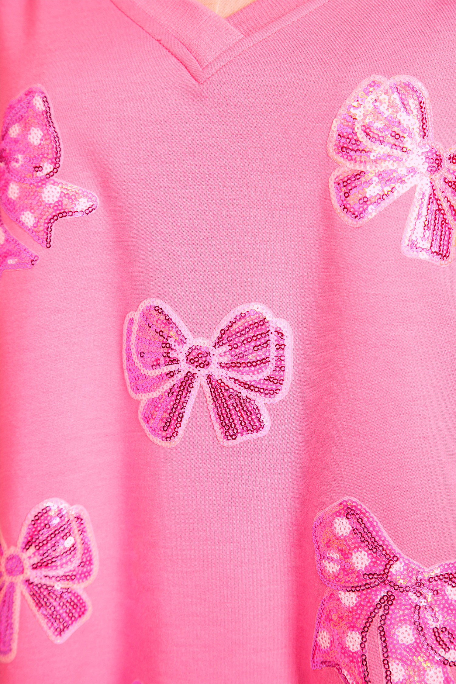 Bonbon Sequined Bow Patched Exposed Seam Bracelet Sleeve High Low T Shirt - loveforevers